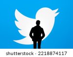 Small photo of Twitter and Elon Musk deal concept. Figurine silhouette is seen in front of blurred Twitter logo on display. Stafford, United Kingdom, October 26, 2022.