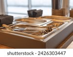 Small photo of Cutlery tray in a cafe, Buffet Food Cutlery Tray. Knives, forks, spoons in a cutlery organizer. Eco-Friendly metal utensils. Sustainability concept