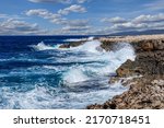 Big waves break on the rocky shore on the mediterranean sea.Cyprus
