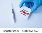 Small photo of mandatory covid-19 vaccination. medicine, healthcare and pandemic concept. medical mask, syringe vaccine mutation, mutated new strain of coronavirus SARS-CoV-2 VUI – 202012-01. Covid-2020