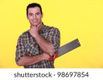 Small photo of Man holding a backsaw