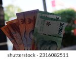 Small photo of Garut, Indonesia. April 22, 2023. New issuance of Indonesian Rupiah Banknotes in 2022. Rupiah banknotes with a nominal value of five thousand, ten thousand and twenty thousand.