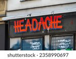 Small photo of Berlin Kreuzberg Germany May 22, 2023: Headache is a headshop on Oranienstrasse. Smoking accessories, bongs, papers, activated carbon filters, vaporizers, various consumer utensils, kratom are offered
