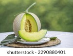 Small photo of Crown Musk Melon on nature background, Shizuoka Crown Melon Yama Grade on Green bokeh background.