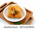 Small photo of Selective focus risoles sosis mayo (American risoles) or mayonnaise sausage rissole is a small patty rolled in breadcrumbs. it is filled with mayonnaise, boiled egg and sausage. Served on white plate.