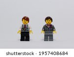 Small photo of tangsel, indonesia- april 9, 2021: photo of office guy and office lady in isolated white background. lego minifigs are made by the lego group.