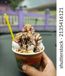 Small photo of Pasir Panjang, Kelantan Malaysia - March 13,2022Ice-cream Baba at Kelantan, Malaysia. Layers of dried bread, jelly, cincau, corn, chocolate,nut and ice-cream.