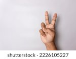 man hand number two gesture. number 2 hand sign isolated on white. peace hand sign.