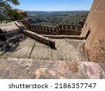 Small photo of a limestone outcrop, gorge and rock formation from the eocene period seen from Alquezar village in Spain, a former fortress with an active church built atop a limestone outcrop