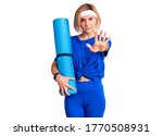 young blonde woman holding yoga ... | Shutterstock . vector #1770508931