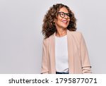 Small photo of Middle age beautiful businesswoman wearing glasses standing over isolated white background looking to side, relax profile pose with natural face and confident smile.