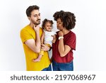 Small photo of Interracial young family of black mother and hispanic father with daughter touching painful neck, sore throat for flu, clod and infection