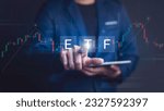 Small photo of Exchange Traded Fund ( ETF ). Financial Success in the Stock Market Businessman Trading on Exchange, Investment Opportunities in Mutual Funds and ETFs, Growing Wealth in the Financial Market.