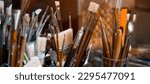 Small photo of Art brushes in different size, materials for oil, acrylic painting, tempera, drawing in the artist's workshop, indoors for creating professional artworks and hobbies.