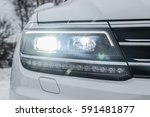 All LED adaptive headlight of a modern car. Headlight consists of individual matrix LED units that can be switched on, off or dimmed, depending on driving conditions.