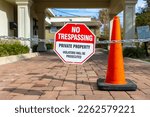 No trespassing sign and cone on property