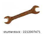 An old rusty wrench on a white background. Vintage wrench close-up.