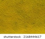 Small photo of yellow felt background texture. The texture of a dark yellow pile made of wool or synthetic felt. Felt fabric with fine pile macro photography.