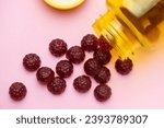 Small photo of Vitamins for children, jelly gummy fruits candy on pink background
