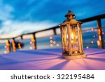 Lantern On Table At Twilight...