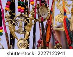 Small photo of Colorful handicraft necklaces and earrings displayed at a marketplace, various shapes and shades of necklaces , handicrafts on display during the Handicraft Fair in Pune, India.