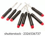 Screwdriver set on isolated white background. Black and red screwdrivers, crosshead, flathead and spanner slotted screwdrivers