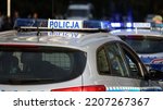 Small photo of 09.24.2022 wroclaw, poland, Polish police patrol car with blue flashing light on the roof of the police car. Alarming in the evening.