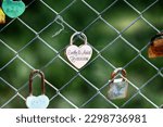 A padlock of a couple in love as a keepsake on the fence.