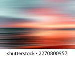 sunset colors on ocean horizon, motion blur