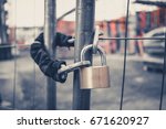 Chain And Padlock On Gate At...