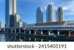 Small photo of LRT skyline Dukuh Atas Jakarta Station, Indonesia - January 20, 2024: The view of the city of Jakarta in Dukuh Atas is visible from the LRT Skyline