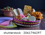 Small photo of Basket with traditional Mexican sweets. Mueganos, ate squares, marzipans, peanut crowns, coconut candy, amaranth candy, cocadas, borrachitos, sevillanas.