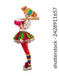 Small photo of Funny female clown club-swinging. Entertainer woman Joker in colorful suit and wig. Buffoon with clown whiteface makeup. Trickster, jester, pantomime, mime. Professional actor