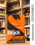 Small photo of Setif, Algeria - January 28, 2023: Close up Nassim Nicholas Taleb's The Black Swan: The Impact of the Highly Improbable book in the bookshop.