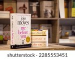 Small photo of Setif, Algeria - April 04, 2023: Close up The English Journalist Jojo Moyes's Me Before You novel in the bookshop.