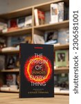 Small photo of Setif, Algeria - May 20, 2023: Close up Graham Lawton's New Scientist: The Origin of (almost) Everything book in the bookshop.