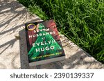Small photo of Setif, Algeria - November 18, 2023: Close-up Taylor Jenkins Reid's The Seven Husbands of Evelyn Hugo novel in the garden.