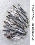 Raw Sardines On Ice Offered As...