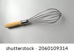 Small photo of Classic egg beater stainless steel material. The handle is made of wood.
