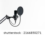 Professional studio microphone with pop filter isolated on the white background in radio studio