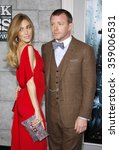 Small photo of Jacqui Ainsley and director Guy Ritchie at the Los Angeles Premiere of "Sherlock Holmes: A Game Of Shadows" held at the Regency Village Theatre in Los Angeles, USA on December 6, 2011.