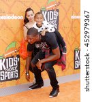 Small photo of Chris Bosh and Adrienne Bosh at the Nickelodeon Kids' Choice Sports Awards 2016 held at the UCLA's Pauley Pavilion in Westwood, USA on July 14, 2016.
