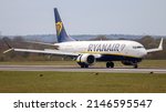 Small photo of Manchester Airport, United Kingdom - 11 April 2022: Ryanair Boeing 737 MAX (EI-HEV) arriving from Lanzarote, Spain.