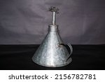 Small photo of Lamparina. Traditional and Antique Lamp. Kerosene lamp, with a burner, the cotton thread smack, which still lights up homes in ,Brazil, India, Africa, and many poor and underdeveloped countries