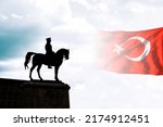 Small photo of Silhouette of monument of Mustafa Kemal Ataturk and Turkish Flag. 30th august Victory Day or 30 agustos Zafer Bayrami background photo.