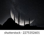 Small photo of Silhouette of Suleymaniye Mosque with crescent moon and milkyway. Ramadan or islamic or laylat al-qadr or kadir gecesi concept photo. Noise effect included.