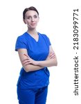 Small photo of Smiling Winsome Professional Female GP Doctor Posing in Blue Doctor's Smock And Hands Folded On White Background. Vertical Shot