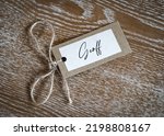 Small photo of Personalised name Geoff place card with string label beautiful crafted placard. Laid on solid oak wooden table named ticket tag.