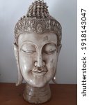 Small photo of Buddha head in ceramic in a meditation semblance