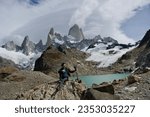 Small photo of A women enjoys the view of Mount Fitz Roy. El Chalten. Argentina.